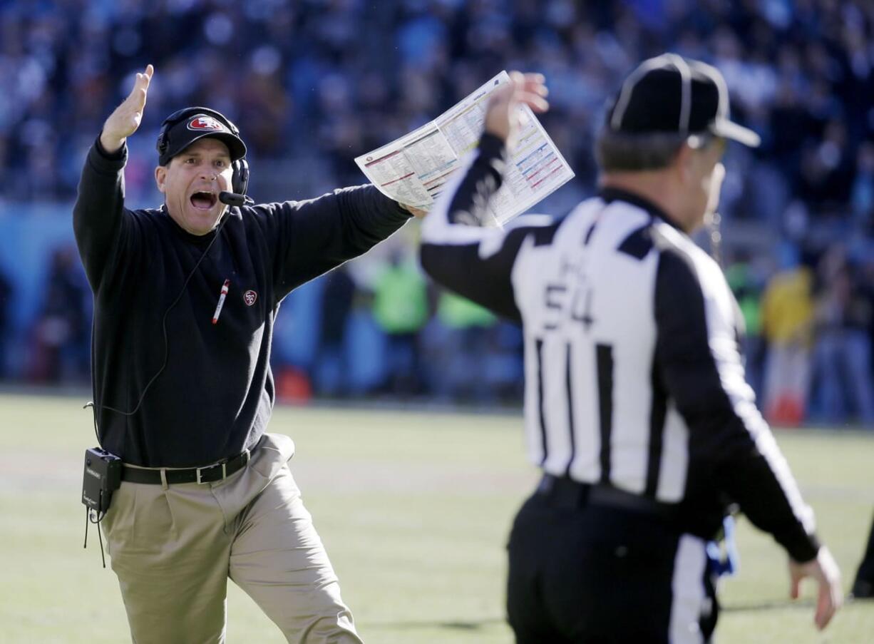 49ers head coach Jim Harbaugh reacts to a call at the end of the first half Sunday.