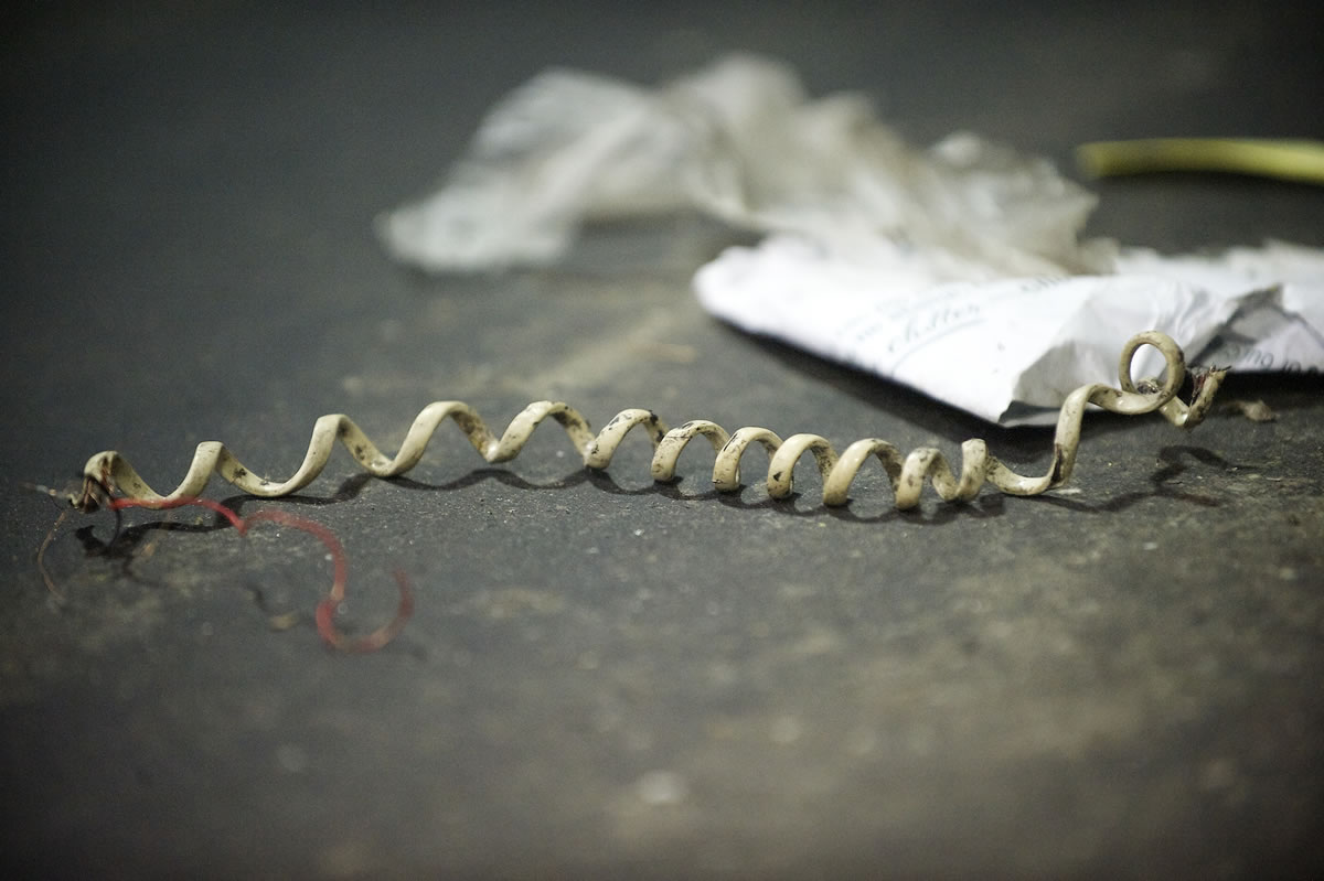 An old phone cord runs along a conveyor belt at the West Van Materials Recovery Center.