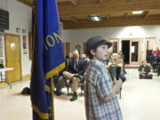 Eli Crabtree, center, 14, and Tanner Howington, 14, far left, make a presentation before they're honored at the Cape Horn American Legion Post 122.