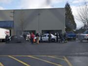 Police secure the scene of Monday's shooting at Benjamin Moore Paints in west Vancouver.