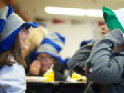 Wearing &quot;Cat in the Hat&quot; chapeaus, Martin Luther King Elementary first-graders Sydney Hines, left, and Marisol Gonzalez enjoy some silliness during the annual green eggs and ham breakfast provided by Beaches Restaurant &amp; Bar and a bevy of volunteers.