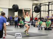 Jessica Core of Vancouver lifts 215 pounds over her head during the CrossFit Fort Vancouver Invitational.