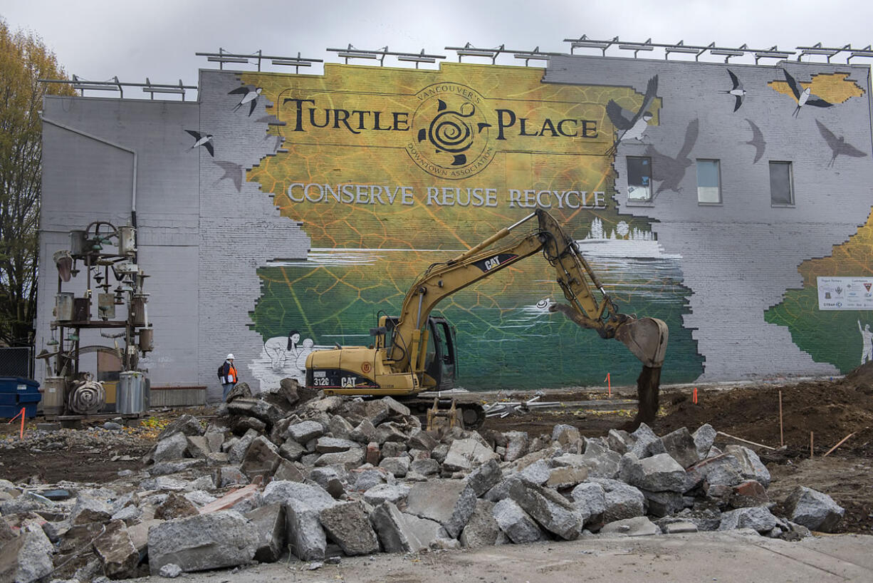 Construction crews from Tapani Underground work at downtown Vancouver&#039;s Turtle Place on the future bus terminus for The Vine, a bus rapid transit service that will run to Westfield Vancouver mall.