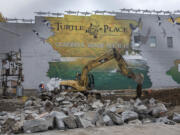 Construction crews from Tapani Underground work at downtown Vancouver&#039;s Turtle Place on the future bus terminus for The Vine, a bus rapid transit service that will run to Westfield Vancouver mall.