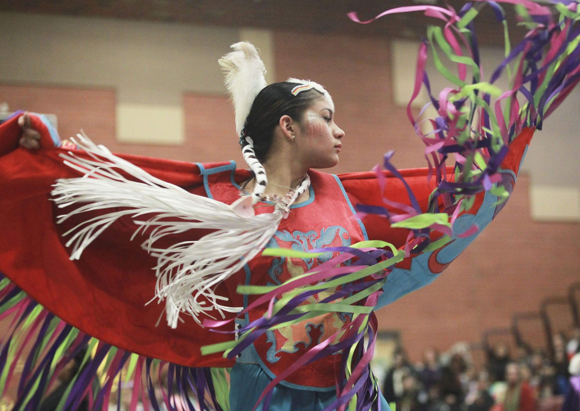 Wearing regalia crafted by family members, Felicia Florendo, 18, a senior at Lewis and Clark High School whose heritage is Wasco-Warm Springs and Eastern Cherokee, dances at the Native American Indian Education Program's traditional powwow Saturday.