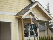 Lance Eppers, from Clearwater Construction, helps build a home in Ridgefield's Green Gables subdivision for Lennar Corp.