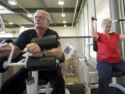 Cecil and Charlane Cardwell, both of whom have had gastric bypass surgery, exercise at the Firstenburg Community Center in Vancouver Wednesday.