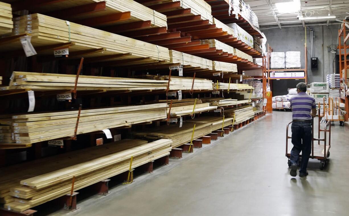 A customer walks past building products at a Home Depot store in Nashville, Tenn., in August 2012. The growing strength of Clark County's housing recovery and a shot of consumer confidence delivered a 9.7 percent increase in local retail sales in the spring, according to a Wednesday report.