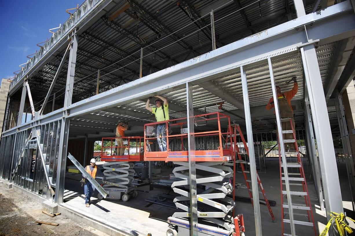 Construction workers for Harlen's Drywall of Vancouver install galvanized metal framing at the Salmon Creek Medical Plaza under construction at Northeast 139th Street and 10th Avenue earlier this year.