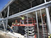 Construction workers for Harlen's Drywall of Vancouver install galvanized metal framing at the Salmon Creek Medical Plaza under construction at Northeast 139th Street and 10th Avenue earlier this year.