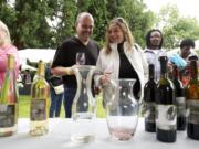 Joe and Michele Stilger of Vancouver sample wines from Moulton Falls winery at last year's Craft Winefest of Vancouver in Esther Short Park.