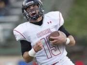 Camas linebacker Michael DiGenova returns a fumble for a score against Evergreen on Oct.