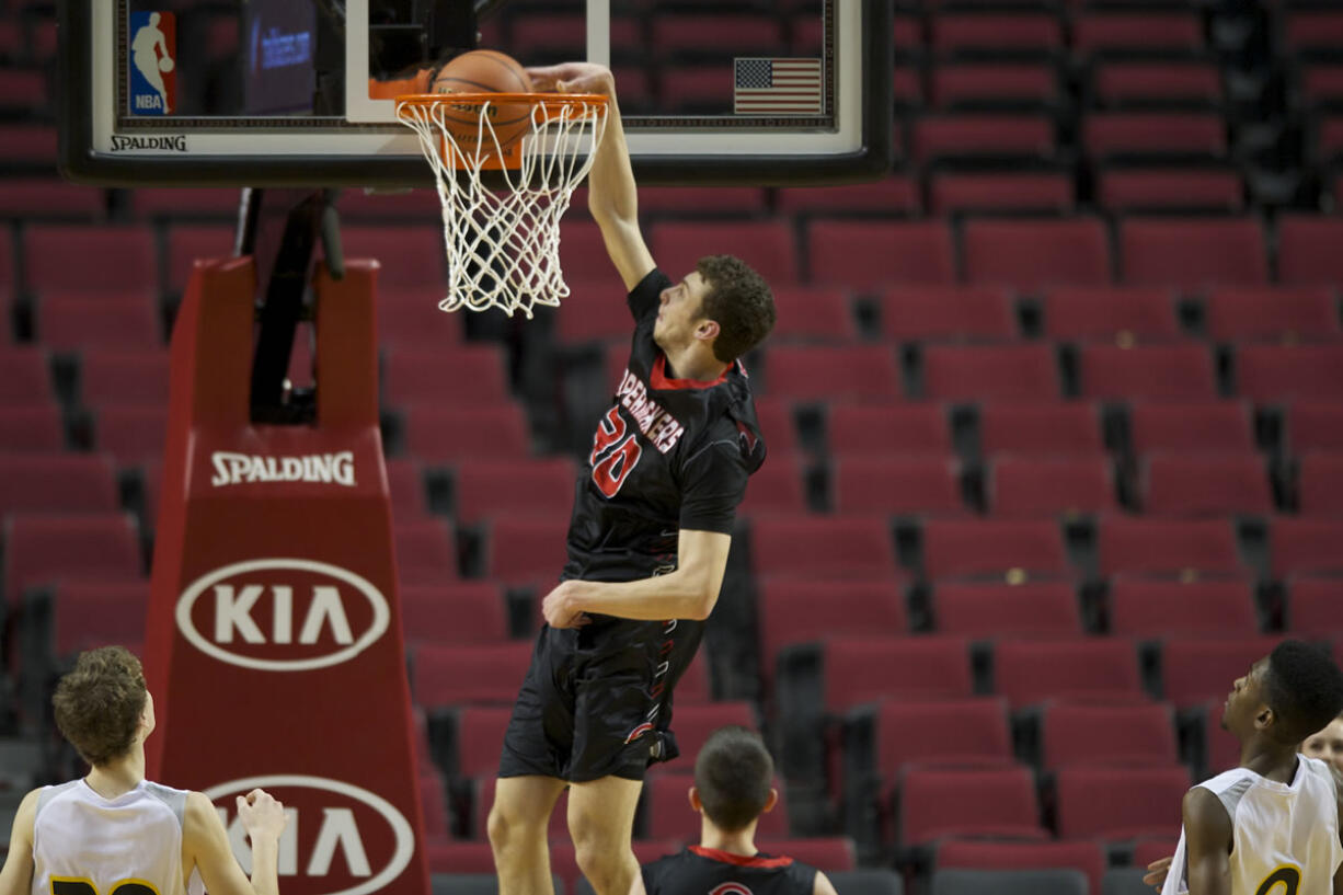 Camas forward Trevor Jasinsky dunks the ball against the Columbia Christian Knights at the Rip City Showcase held at the Moda Center, Friday, January 3, 2014.