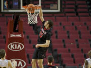 Camas forward Trevor Jasinsky dunks the ball against the Columbia Christian Knights at the Rip City Showcase held at the Moda Center, Friday, January 3, 2014.