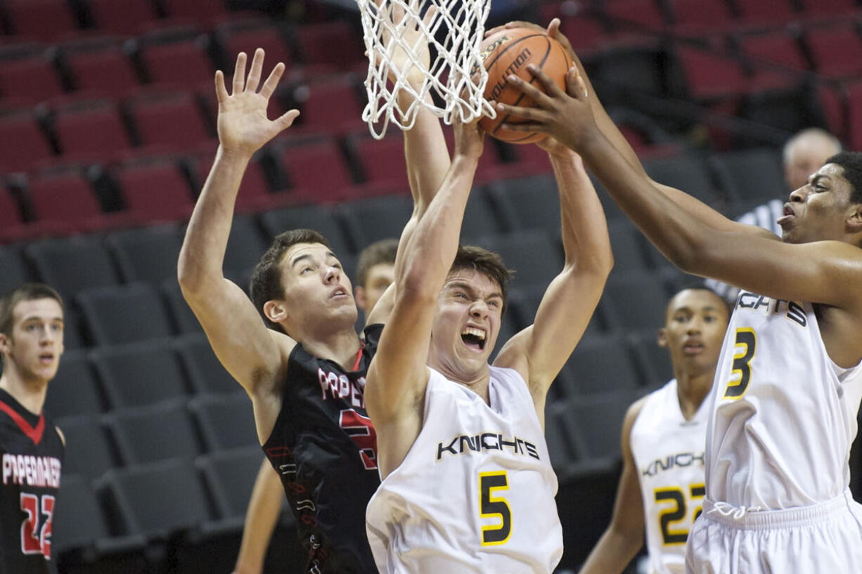 Vancouver resident Arkadiy Mkrtychyan (5) rebounds against Camas at the Rip City Showcase held at the Moda Center on Friday.