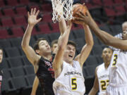 Vancouver resident Arkadiy Mkrtychyan (5) rebounds against Camas at the Rip City Showcase held at the Moda Center on Friday.