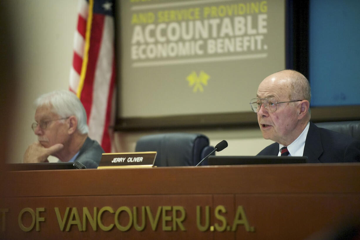 Port of Vancouver Commission President Jerry Oliver instructs participants before the start of public comments during the reopening of the discussion and vote on a proposed oil terminal lease Oct. 22 in Vancouver.