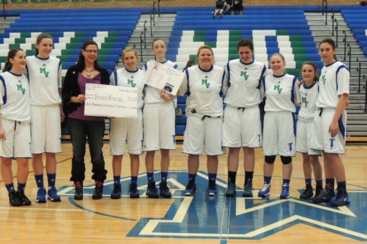 Mountain View: Mountain View High School's Lady Thunder basketball team presents a check for $1,620 to a representative from Breast Friends on Feb.