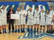 Mountain View: Mountain View High School's Lady Thunder basketball team presents a check for $1,620 to a representative from Breast Friends on Feb.