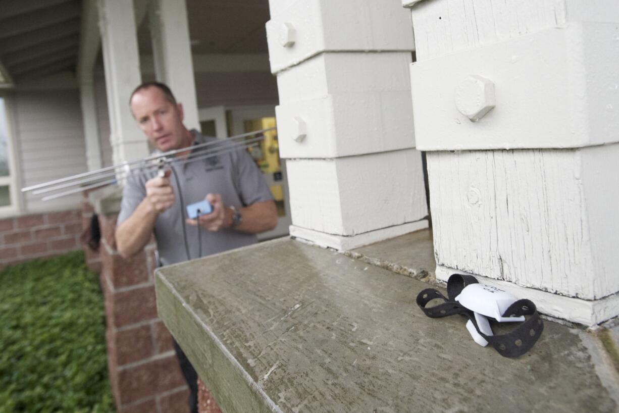 Clark County sheriff's deputy Bob Carder trains with equipment that uses radio frequency tracking to find vulnerable adults and children.