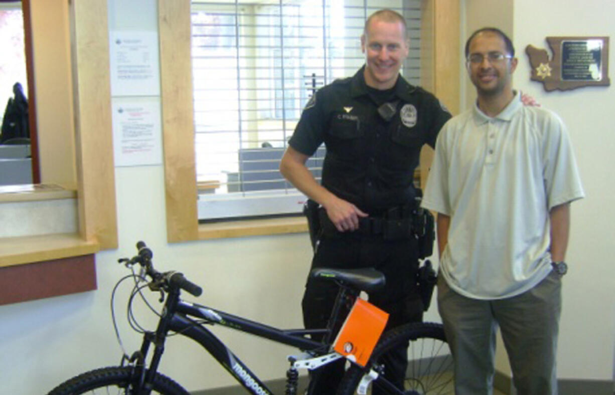 Battle Ground Police Officer Clint Fraser helped get Kishan &quot;Sam&quot; Aylor a bike after his was damaged when a vehicle crashed into him last month.