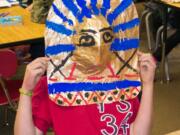 Ridgefield: Union Ridge Elementary School sixth-grader Jason Gasca puts on a mask he made during a recent class lesson on Egyptian history.