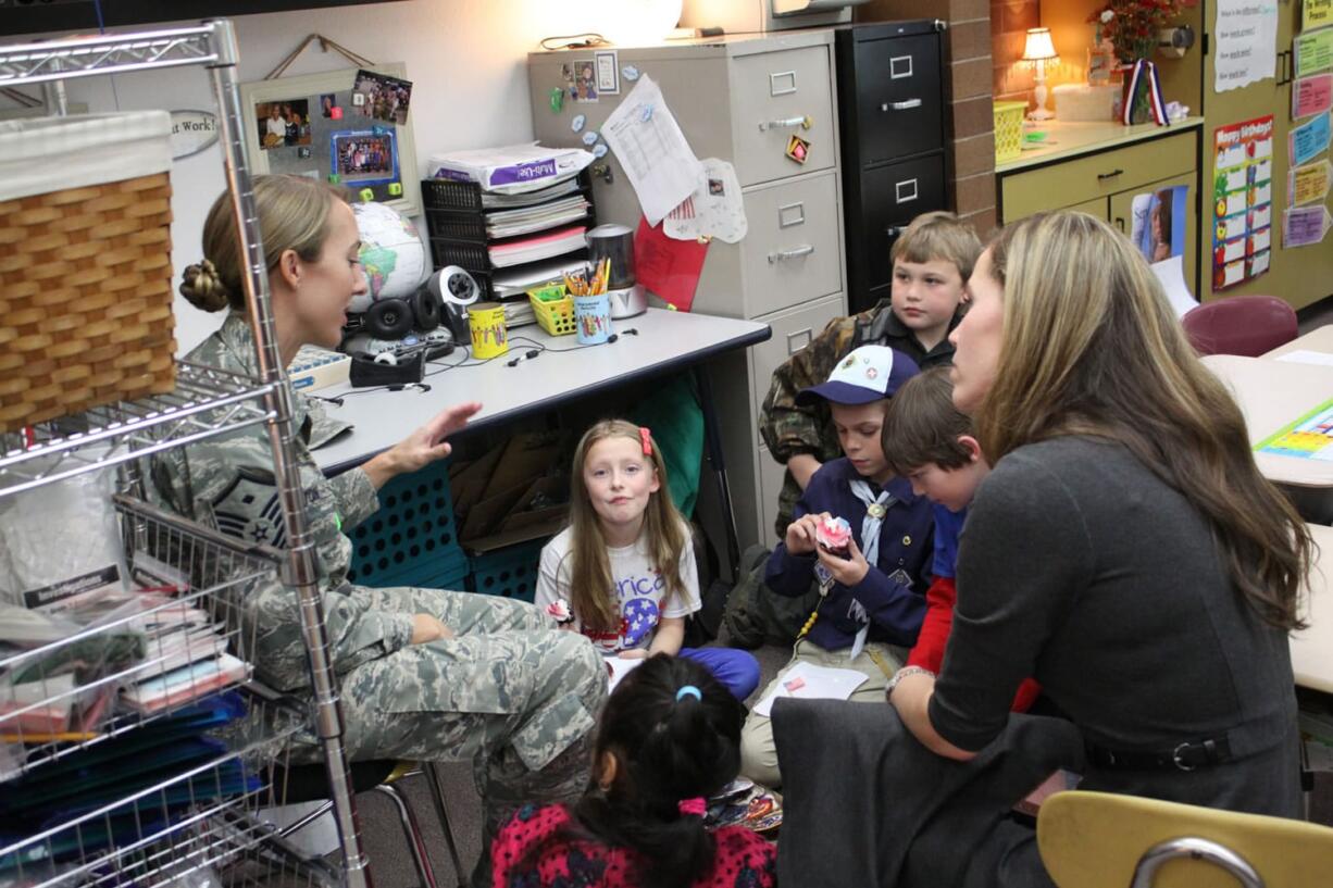 Woodland: During a Veterans Day visit to Melissa Sanders' third-grade class at Woodland Primary School, Master Sgt.