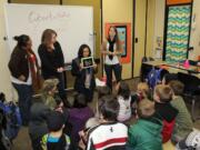 Pleasant Valley: Students in Teresa Taylor's third-grade class at Pleasant Valley Primary School watch an anti-bullying video on an iPad during a recent class lesson on Internet safety.