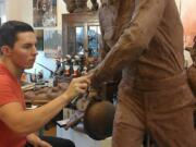 Hockinson: 20-year-old Chad Caswell from Hockinson works on a sculpture of World War II soldier Leonard DeWitt, from McMinnville, Ore.