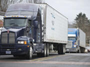 A parade of trucks rumbles down First Street in Stevenson on Friday afternoon.