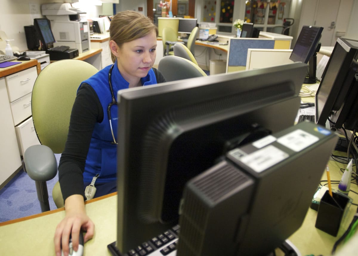 Registered nurse Kristina Kinnunen works in the pediatric unit at Legacy Salmon Creek Medical Center during a recent 12-hour shift.