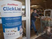 A shopper pushes a grocery cart past a sign welcoming shoppers to participate in online grocery shopping at Fred Meyers in Vancouver Tuesday November 3 , 2015.(Natalie Behring/The Columbian)
A shopper pushes a grocery cart past a sign welcoming shoppers to participate in online grocery shopping at Fred Meyers in Vancouver Tuesday November 3 , 2015.(Natalie Behring/The Columbian)
The Fred Meyer store in Orchards at 7411 N.E. 117th Ave. is the first in the chain to offer an online grocery service. Customers can order online, set a pickup time for the next day, and do their grocery shopping without setting foot in the store. (Natalie Behring/The Columbian)
