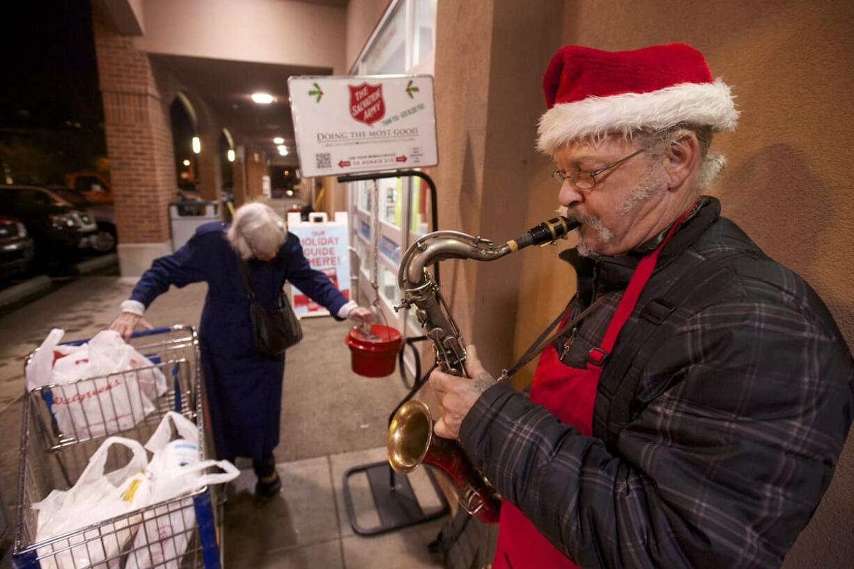 Salvation Army bell ringer Kennie Campbell, 51, has traded his bell for a saxophone and plays Christmas carols plus the occasional secular classic, like &quot;Ain't We Got Fun?&quot; He's stationed at Walgreens, at Fourth Plain and Main.