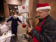 Salvation Army bell ringer Kennie Campbell, 51, has traded his bell for a saxophone and plays Christmas carols plus the occasional secular classic, like &quot;Ain't We Got Fun?&quot; He's stationed at Walgreens, at Fourth Plain and Main.