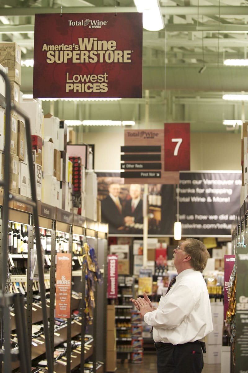 Wine associate Ron Bond looks over the wine offerings at Vancouver's Total Wine &amp; More.