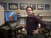 Sign designer Garrett Mattimoe at his work at his desk at the Vancouver Sign Group in Vancouver, Tuesday November 10 , 2015.