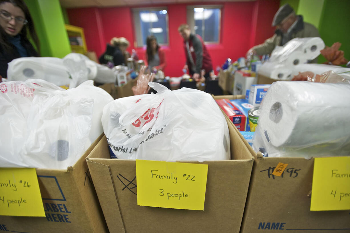 Filled boxes of food for families in need sit Sunday at the Vancouver First United Methodist Church ready to be delivered Monday.