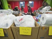 Filled boxes of food for families in need sit Sunday at the Vancouver First United Methodist Church ready to be delivered Monday.