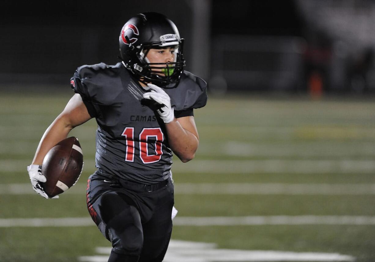 Senior Jordan Del Moral of Camas High School runs with the ball during a playoff game vs.