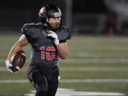 Senior Jordan Del Moral of Camas High School runs with the ball during a playoff game vs.