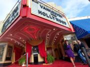 Greater Vancouver Chamber of Commerce President and CEO Kelly Parker walks toward Main Street as Braden and Amy Hurt of Vancouver arrive at the Academy Awards viewing party at Kiggins Theatre.