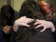 Mandy Cooper, right, embraces Vicky Smith of Grace Ministries and Xchange in February, on her second day at the Grace Lodge detox center.