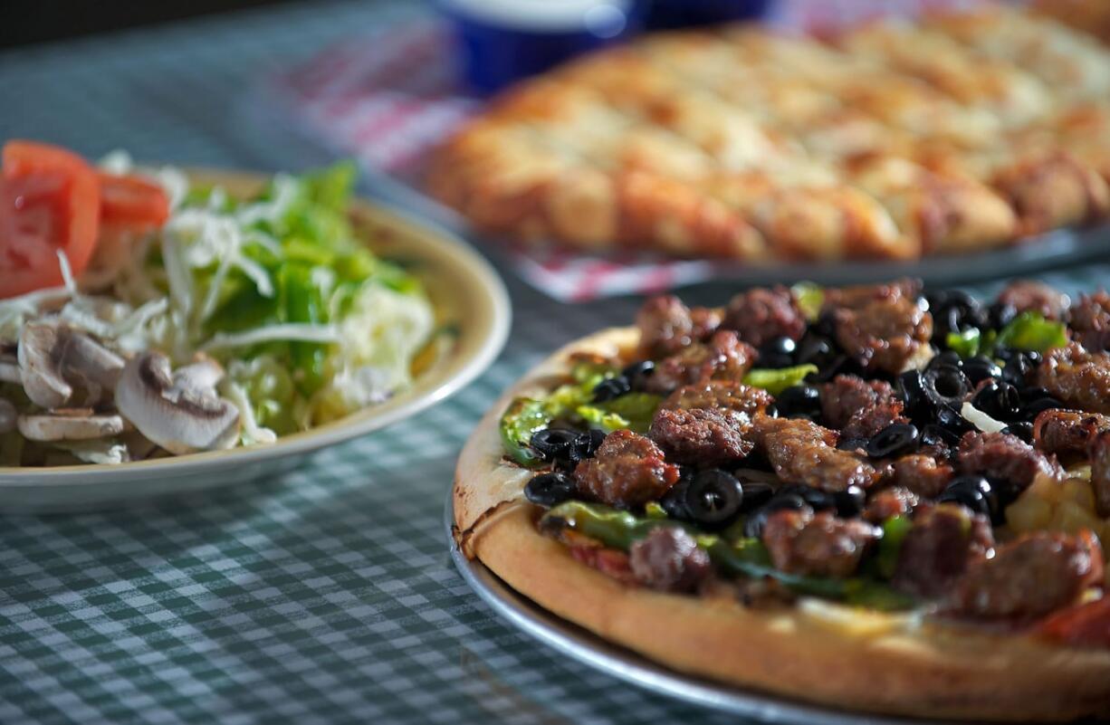 Hurricane pizza, deadsticks with ranch dressing, and garden salad at Juliano's Pizzeria on Feb.