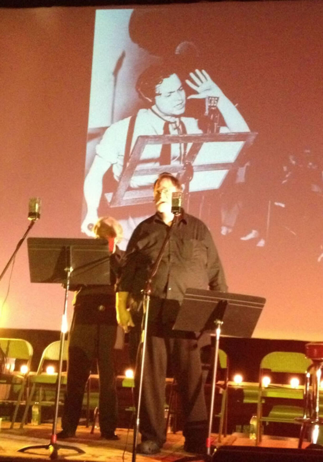 Esther Short: Director Sam Mowry of the Willamette Radio Theater, with inspiration from Orson Welles on the screen behind him, reassures the world that Mars is nothing to worry about.