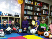 Sunnyside: Cornerstone Christian Academy students show off pumpkins they transformed into characters from their favorite books on Oct.