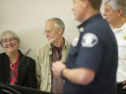 Candace Yarnell, left, smiles next to her husband, Herschel Yarnell, as Capt. Jason Mansfield of Fire District 3 talks during a PulsePoint media conference on Friday. Candace saved her husband's life earlier this year with help from a CRESA dispatcher when her husband went into cardiac arrest.