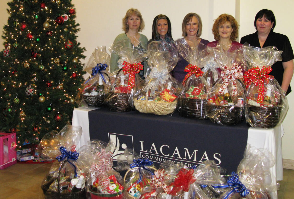 Camas: Lacamas Community Credit Union employees, from left, Cornelia Floyd, Tierra Stone, President and CEO Kathleen Romane, Eve Rossmiller and Tracy Thomas have their gift baskets all ready.