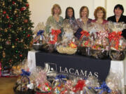 Camas: Lacamas Community Credit Union employees, from left, Cornelia Floyd, Tierra Stone, President and CEO Kathleen Romane, Eve Rossmiller and Tracy Thomas have their gift baskets all ready.