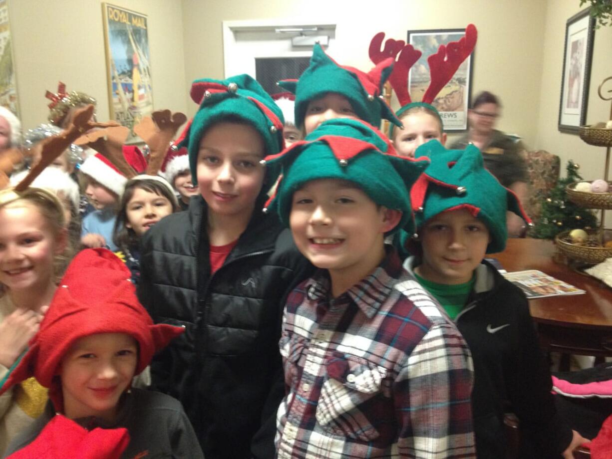 Battle Ground: Tukes Valley Primary students visit seniors at Mallard Landing Assisted Living in an effort to spread holiday cheer on Dec.