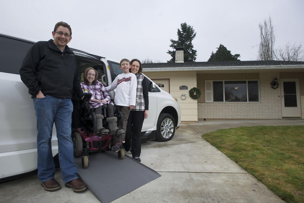 Eric, 12-year-old Emily, 7-year-old Daniel and Triann Benson smile about the new addition to their Minnehaha-area household: a specially retrofitted Toyota Sienna minivan. An anonymous donor made the $25,000 down payment on the customized $75,000 vehicle, which will allow Emily's parents to take her with them when they go on trips short and long -- just like any other kid.